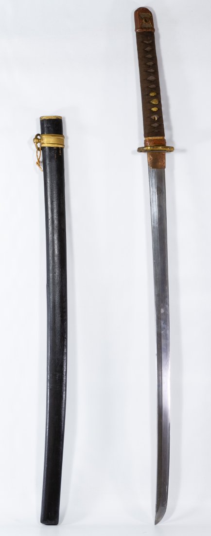 Japanese Katana Sword and Scabbard: Japanese Katana Sword and Scabbard Having etched markings on the tang, a brown cord wrapped wood handle, a metal blade and a marked wooden sheath Length: 36.50 inches Category: Military & Weapons > Sa