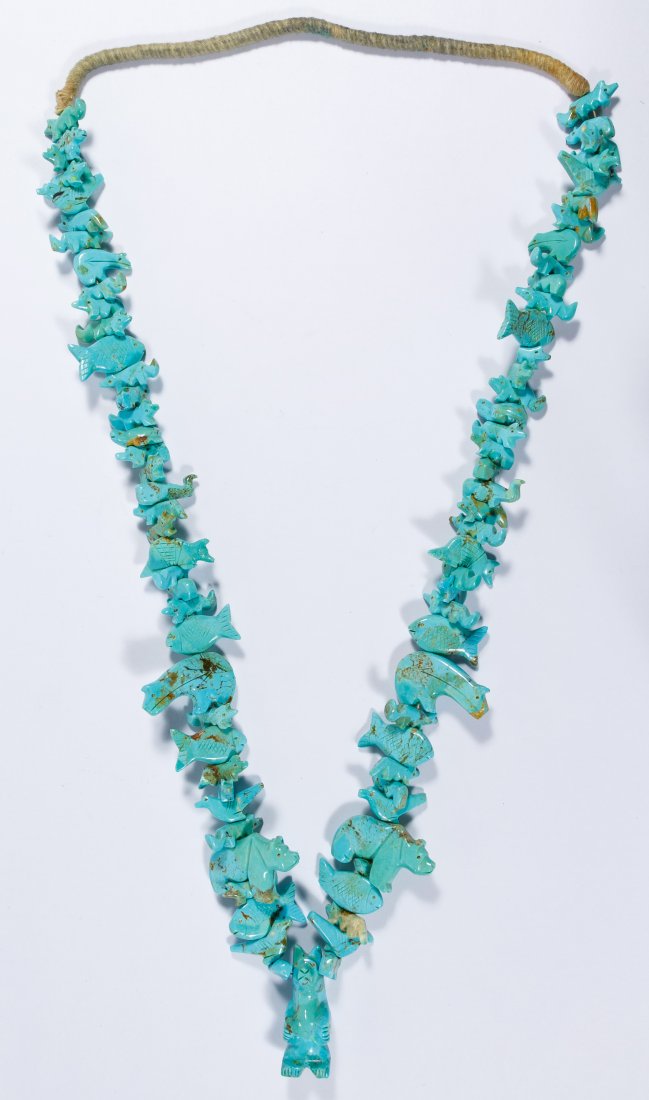 Native American Turquoise Carved Fetish Necklace: Native American Turquoise Carved Fetish Necklace Having seventy-eight carved birds, fish, turtles, whales, bears and other animals with a central standing bear Length: 31.00 inches Category: Jewelry &