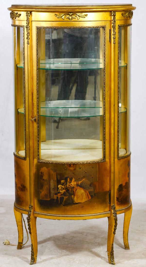 French Vitrine Cabinet: French Vitrine Cabinet Having a curved glass door and side panels, gilded wood and trim with figural applications Height: 56.00 inches, Width: 27.50 inches, Depth: 15.00 inches Category: Furniture > C