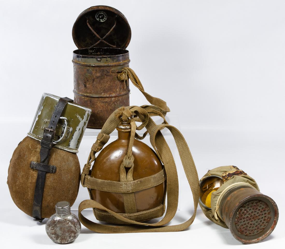 World War II German and Japanese Canteen Assortment: World War II German and Japanese Canteen Assortment Four items including a German canteen with cup and strap a Japanese canteen with a canvas shoulder strap and a small flask; together with a German g