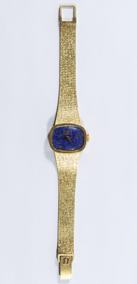 Omega 14k Gold Case and Band Women's Wrist Watch: Omega 14k Gold Case and Band Women's Wrist Watch Having a seventeen jewel Swiss movement and a blue face; marked '14k' on back of case, inside back of case and clasp Weight: 0.87 ozt. (total weight) C
