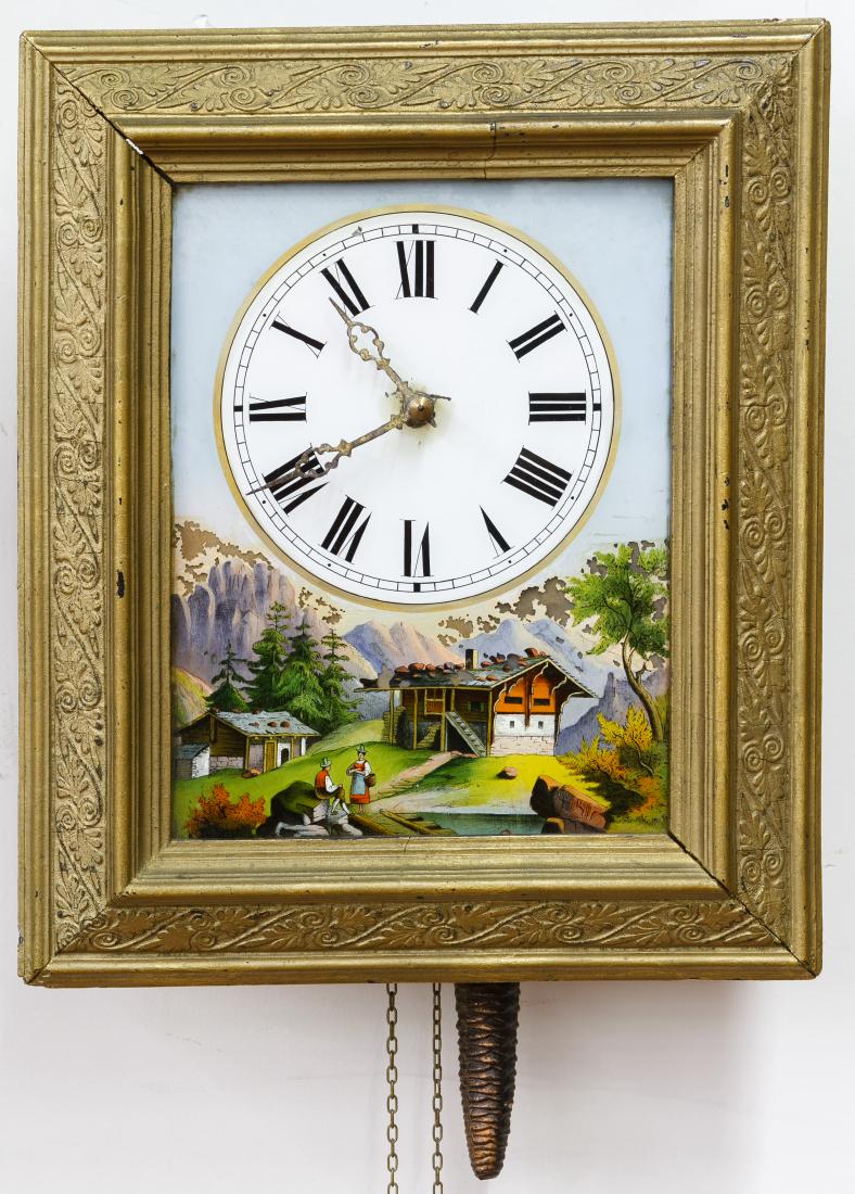Reverse Painted Glass Wall Clock: Reverse Painted Glass Wall Clock 19th Century, having an Alpine German mountain view below the face and wood frame; without key, pendulum and weights Height: 14.50 inches, Width: 12.25 inches, Depth: 