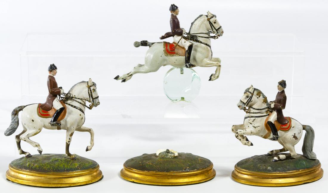 Painted Metal Lipizzaner Horse Figurines: Painted Metal Lipizzaner Horse Figurines Three painted lead horse and rider figures mounted onto oval plaster filled bases; one has a glass inset mount Height: 3.75 inches (all) Category: Collectibles