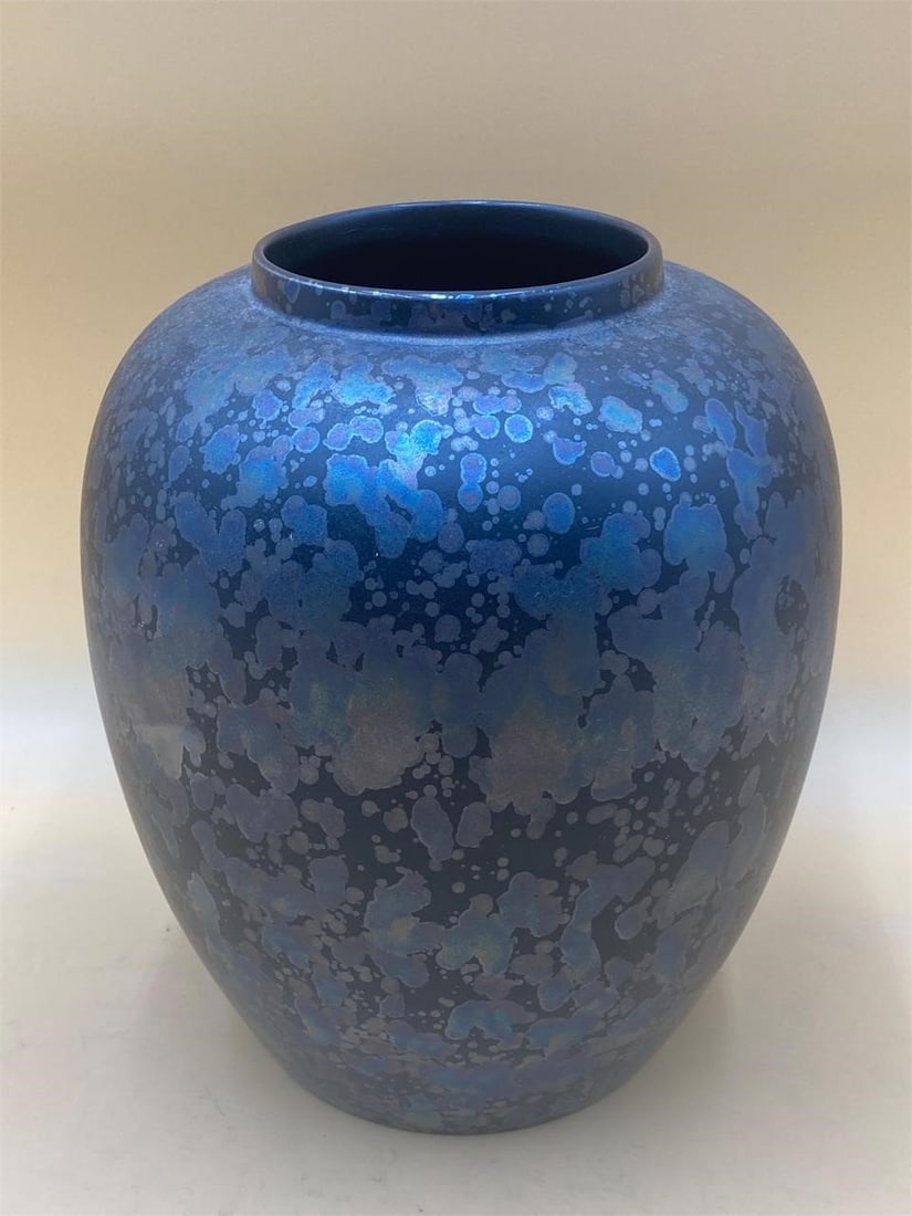 Poole Pottery Queensberry Hunt Calypso Vase: Poole Pottery of England Queensberry hunt edition calypso vase. Matte black base glaze with splotch patterned iridescent blue sections. Vase measures 9" tall and is in good condition.