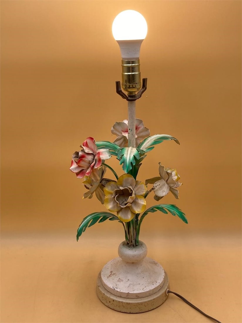 Vintage Metal Toile Lamp: Vintage mid century metal toile lamp. Features metal flower and leaf designed body with red, Yello and green colors. Lamp measures 19" without shade. Tested in working condition. Lamp has some surface
