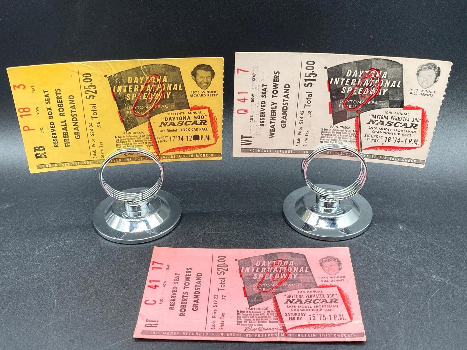 1974 & 1975 Daytona 500 & Permatex 300 Ticket Stub: 1974 Daytona 500 and 1974 & 1975 Daytona Permarex 300 ticket stubs. Daytona 500 & 1975 Permatex 300 tickets show visible creases and wear, 1974 Permatex ticket has lighter crease in middle.