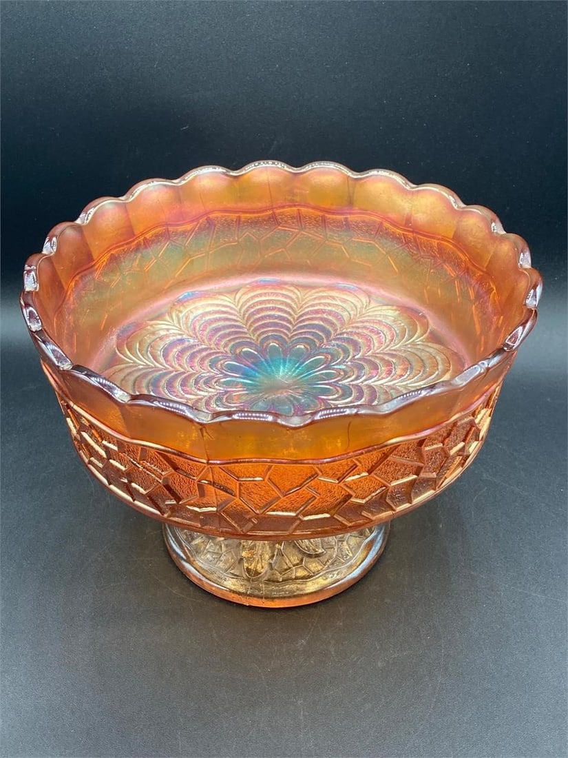 Carnival Glass Marigold Persian Pedestal Bowl: Carnival glass iridescent marigold Persian pedestal bowl. Features Persian spiral patterns on inside of bowl with leaf and vine patterned base. Some cracks around rim as noted in photos.Measurements: 