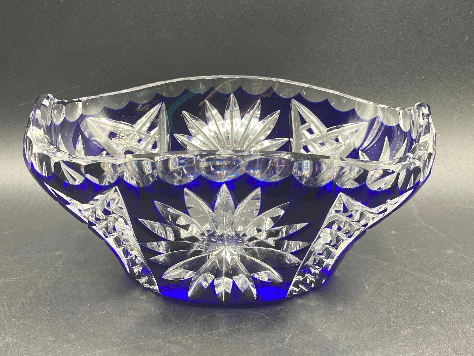 Nachtmann Blierkstahl Cut To Clear Blue Dish: Nachtmann Blierkstahl cut to clear lead crystal glass cobalt blue dish. Bohemian made crystal glass with cut geometric and starburst patterns with cobalt blue coloring. Dish is in good condition.Measu