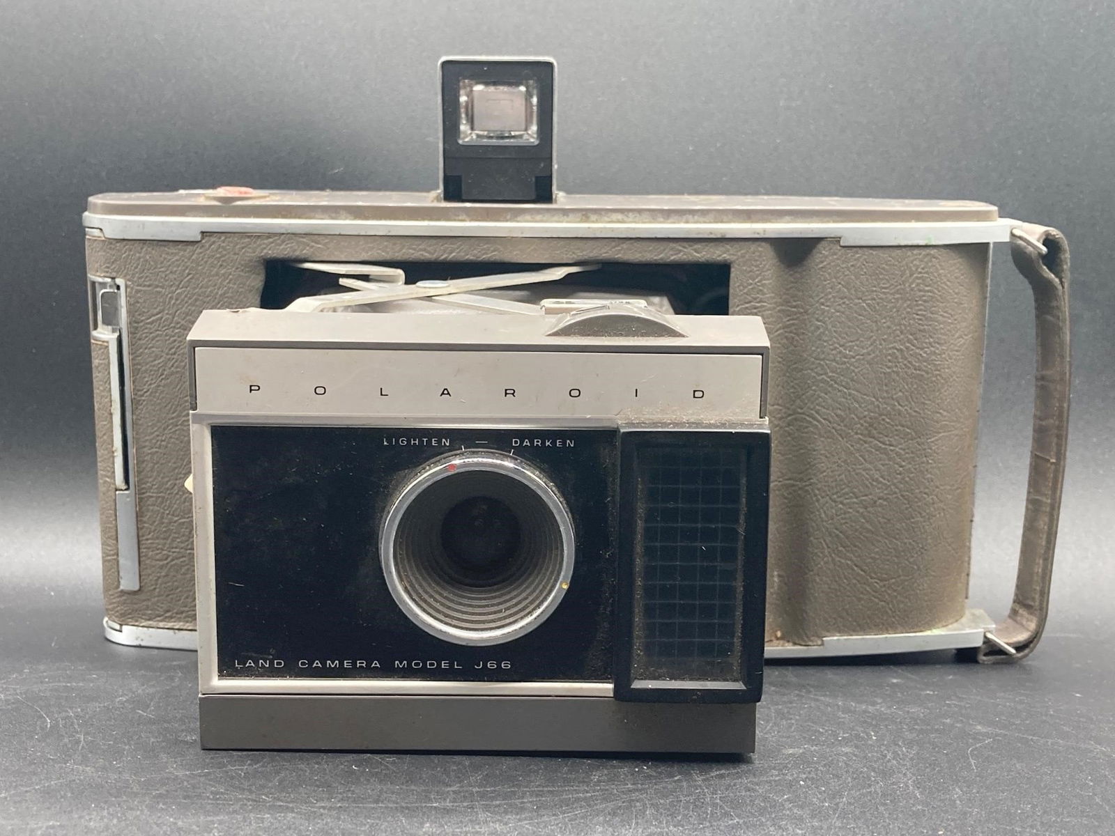 Polaroid Land Camera Model J66: Polaroid land camera model J66. Foldable instant camera with exposure compensation and scene selection for easy focus. Camera inspected mechanically, camera works properly and bellows is free of tears