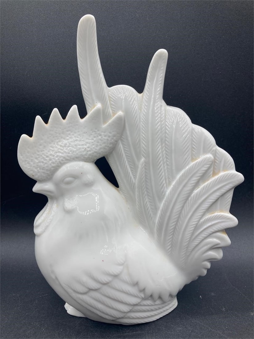 MCM Porcelain Rooster Figure: Mid century porcelain rooster figure. White glaze with detailed face and feathers. Good condition.Measurements: 4" W, 6" L, 9" H inches 1 pound