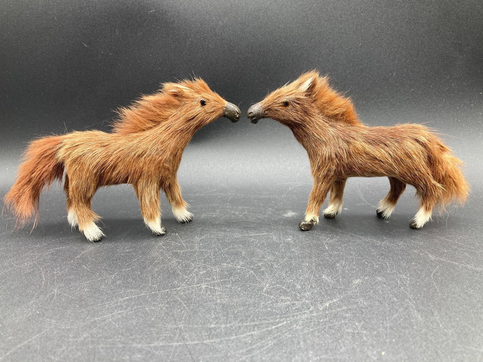 Horse & Deer Figurines W/ Real Hair: Set of four miniature horse and deer figurines featuring real horse and deer fur and glass eyes. Figures measure 4" to 5" long. Some minor areas of damage to horse figures are noted in photos, overall