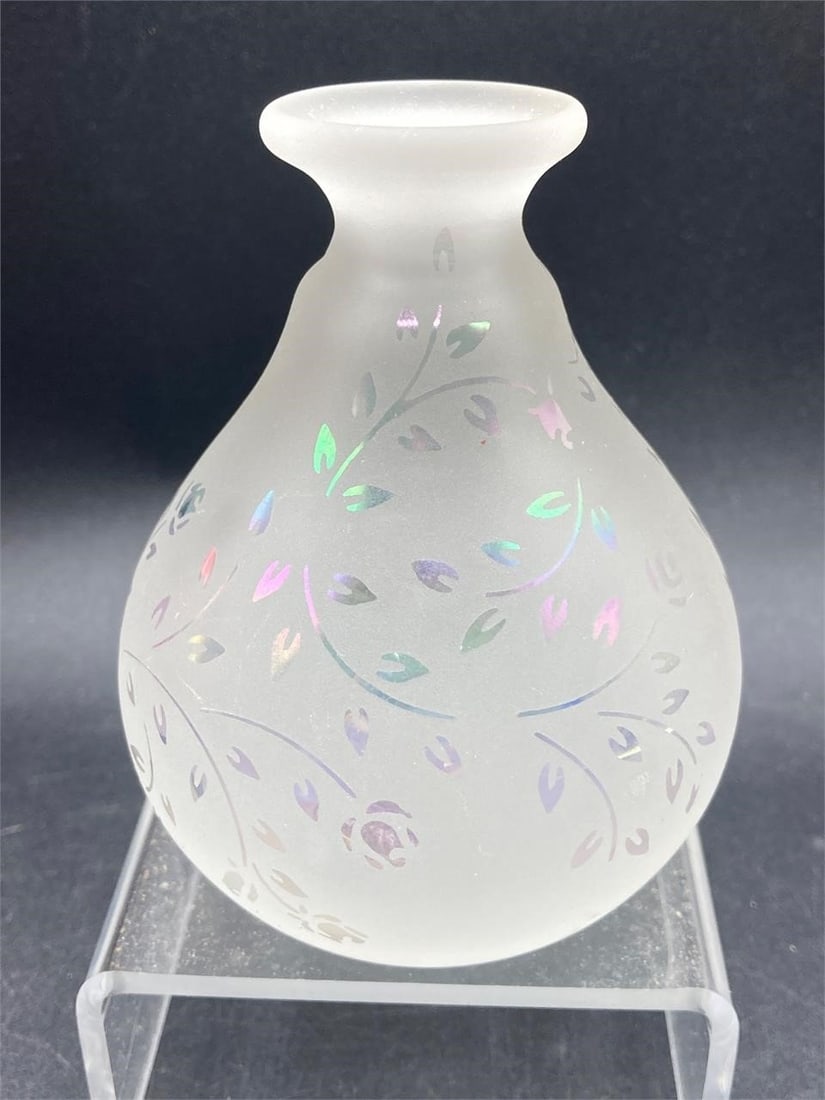 Glass Act Frosted And Iridescent Perfume Bottle: Glass Act Studio frosted glass and iridescent perfume bottle. Features frosted glass body with iridescent flowers and vines designs that change color under different lighting. Measures 4" tall. Bottle