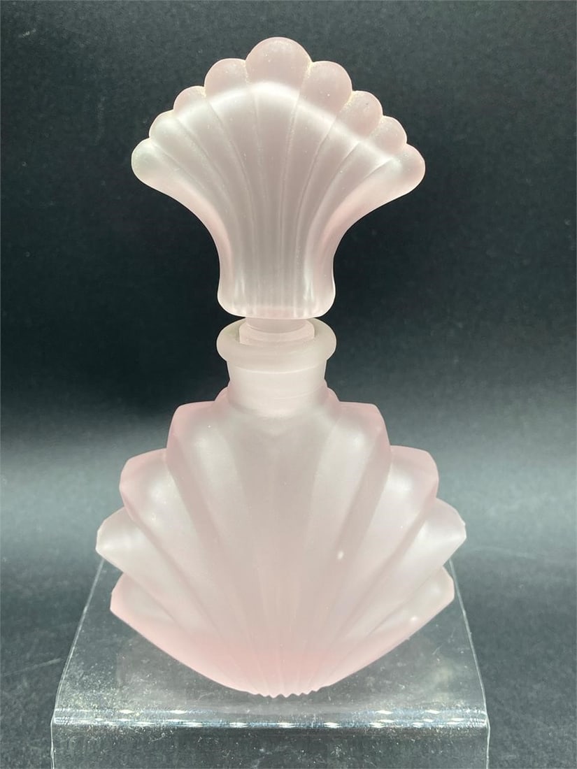 Vintage Cameo pink satin glass art deco perfume bottle. Features pink colored frosted glass with: Vintage Cameo pink satin glass art deco perfume bottle. Features pink colored frosted glass with seashell shaped stopper and art deco styled body. 4 1/2" tall. Bottle is in excellent condition.Measure