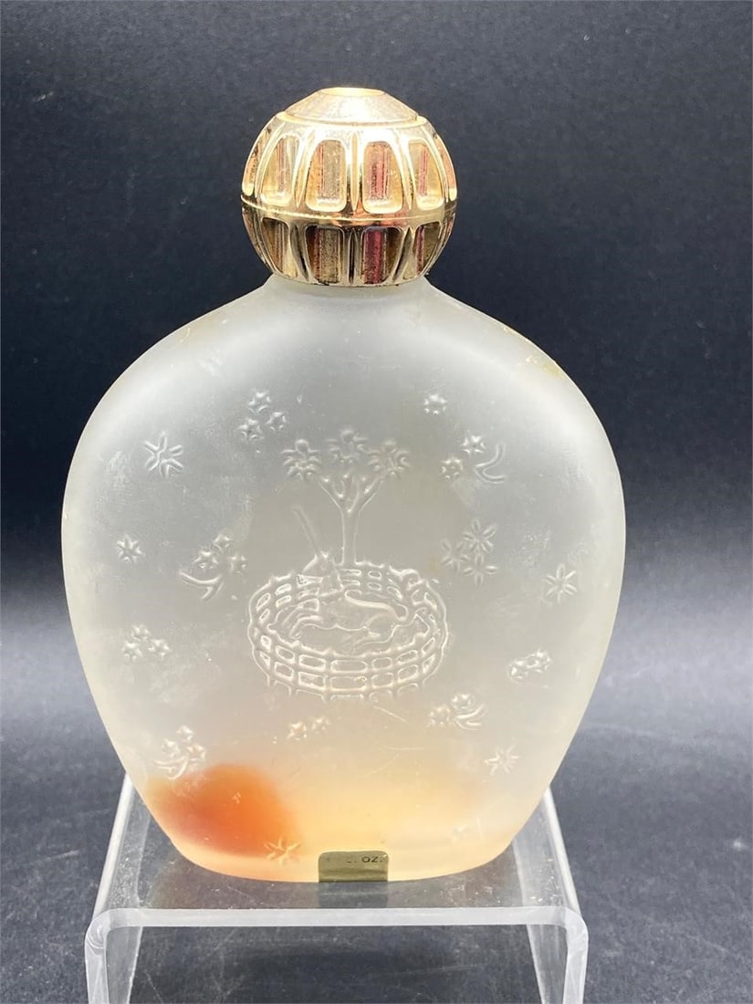Vintage Fame by Corday perfume bottle. Frosted glass bottle with unicorn and star designs and gold: Vintage Fame by Corday perfume bottle. Frosted glass bottle with unicorn and star designs and gold tone screw top cap. 5" tall. Some residue inside bottle, otherwise good condition.Measurements: 1.5" 