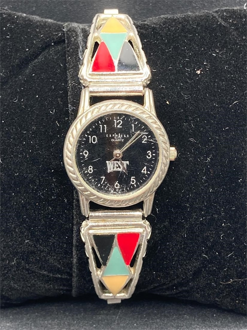 Vintage LA Express West watch. Features elastic metal band with multi colored triangle designs and: Vintage LA Express West watch. Features elastic metal band with multi colored triangle designs and silver tone elastic metal band. New battery installed, tested in working condition. Some small scratc
