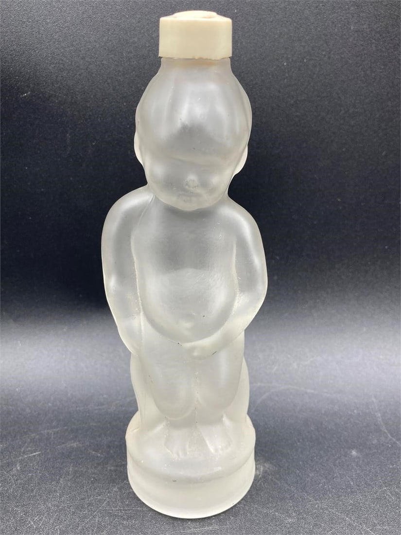 Vintage Morozoff Naught Boy Glass Decanter: Vintage Morozoff naught boy decanter. Features frosted glass in shape of nude boy. Measures 6.5" tall. Good condition.Measurements: 3" W, 3" L, 7" H Inches 1 pound