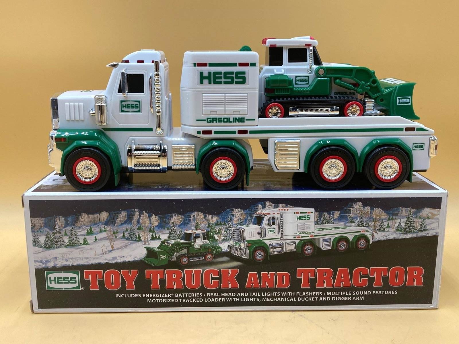 2013 Hess Truck & Tractor Toy: 2013 Hess truck and tractor toy in original box. Features battery powered lights and sounds. Tractor toy features motorized tracks. Toys are in excellent condition. Battery functions not tested.Measur