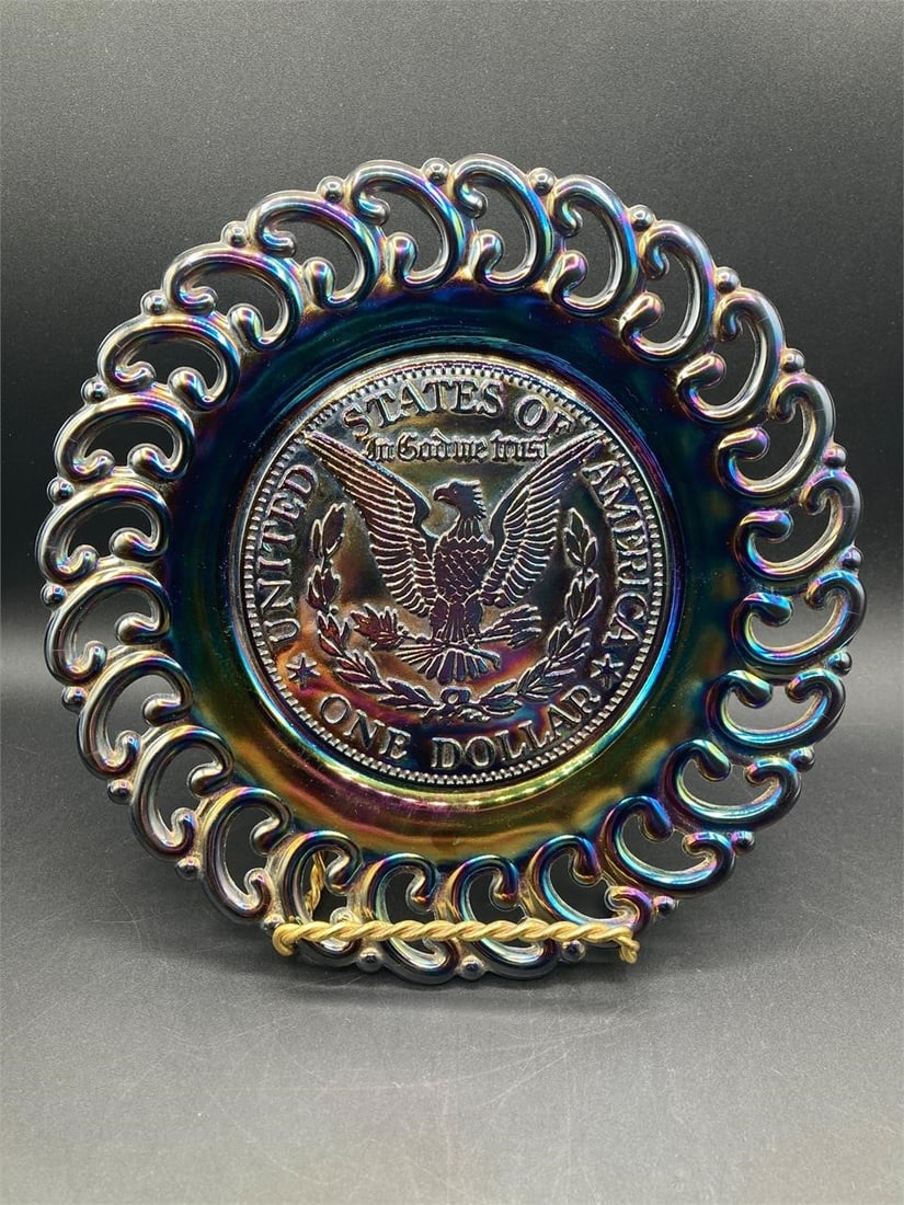 L.E. Smith U.S. One Dollar Amethyst Glass Plate: Vintage L.E. Smith amethyst glass United States dollar plate. Features U.S. dollar seal design middle with swirled rim on iridescent amethyst glass that changes color under different lighting. Measure
