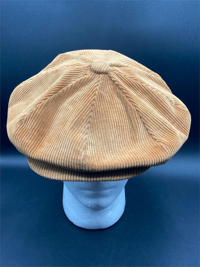 Pen West Corduroy Newsboy Hat: Pen West corduroy newsboy hat. Corduroy exterior with polyester lining. Tan color. Large size. Snap closure button does not close, otherwise hat is in good condition.Measurements: 11" W, 11" L, 2" H I