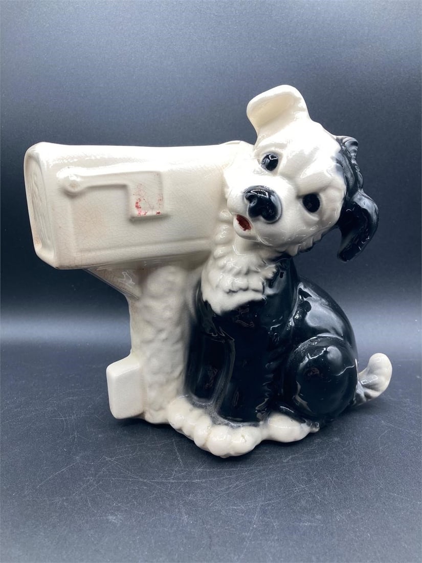 Vintage Royal Copley porcelain dog & mailbox planter. Features puppy design with black and white: Vintage Royal Copley porcelain dog & mailbox planter. Features puppy design with black and white color glazes and mailbox planter section. Natural crackling visible under glaze. Measures 8" tall. Plan