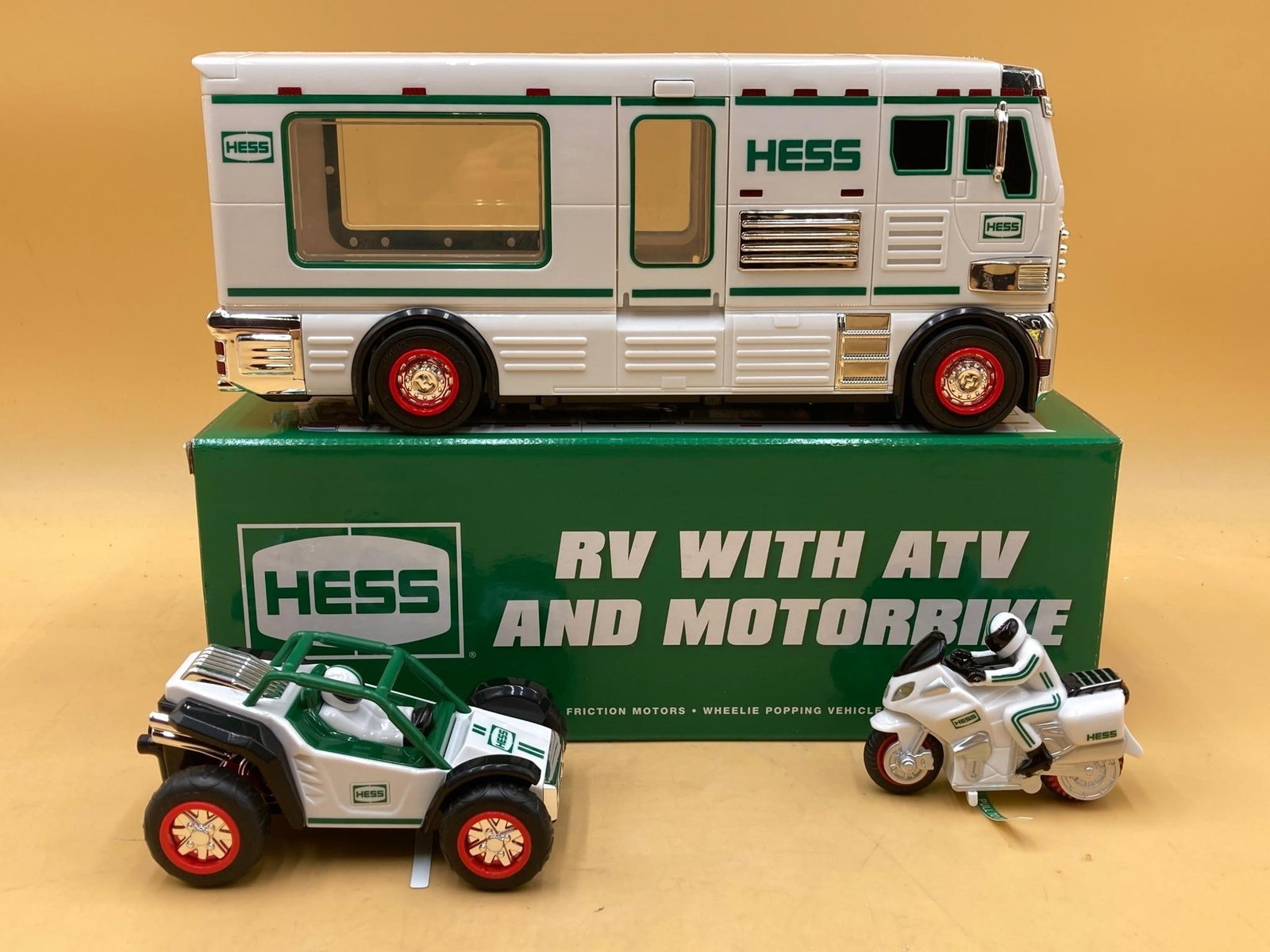 2018 Hess RV with ATV and motorcycle toy in original box. RV features battery powered lights with: 2018 Hess RV with ATV and motorcycle toy in original box. RV features battery powered lights with opening doors and ramp. ATV and motorcycle features friction motors for self propulsion. Toys are in e