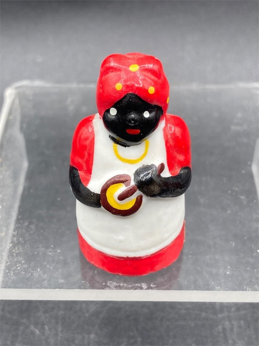 Vintage Black Americana Mini Figurines: Pair of Taiwanese made black Americana porcelain miniature figurines. Hand painted figures with hollow bodies. Measures 1 3/4" tall each. Both figures are in excellent condition. 4456-9Measurements: 1