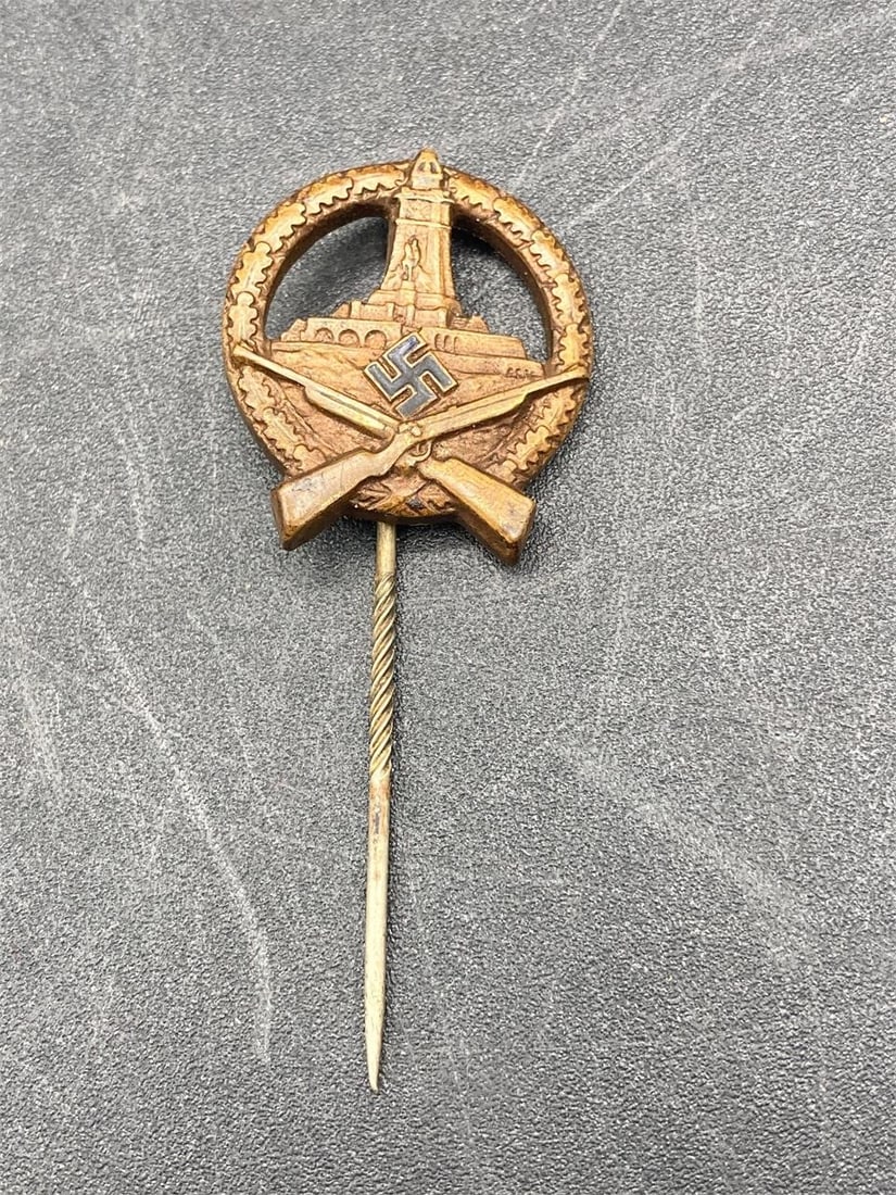 German WWII Rifle Marksmanship Pin: German world war II rifle marksmanship pin. NSDAP maker stamp on back noted in photos. Measures just over 7/8". Pin is in excellent condition.Measurements: 1" W, 2.5" L, 1" H, 1 pound
