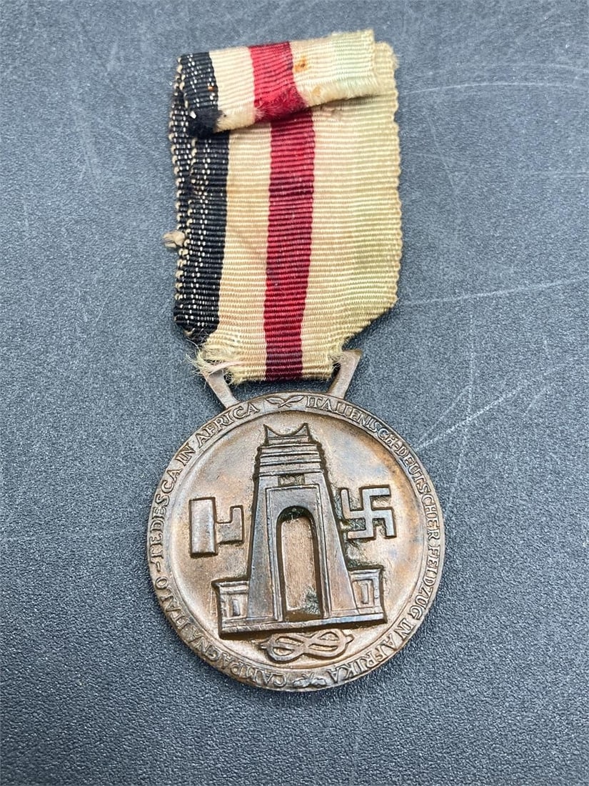 1941 WWII Italo-German African Campaign Medal: 1941 world war II Italo-German African campaign medal with ribbon. Issued to German and Italian soldiers who served in North Africa. Medal measures 1 1/8". Some light wear on ribbon, overall item in i