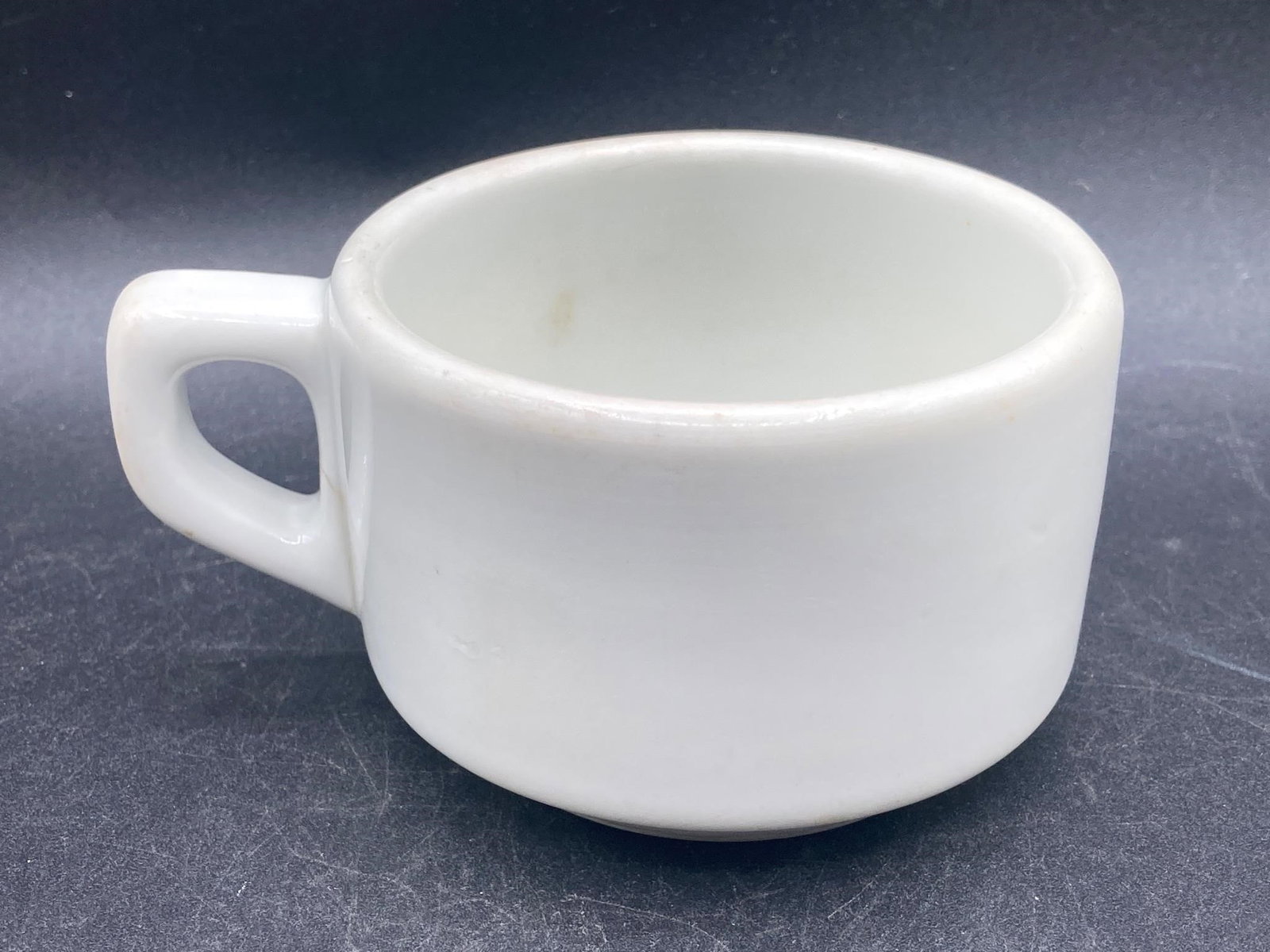 Original German WWII Luftwaffe Coffee Cup: Original German world war 2 luftewaffe mess hall porcelain coffee cup. Dated 1940, issued to German air force members for use as base mess halls. Stamp on bottom noted in photo. Crack noted by handle,