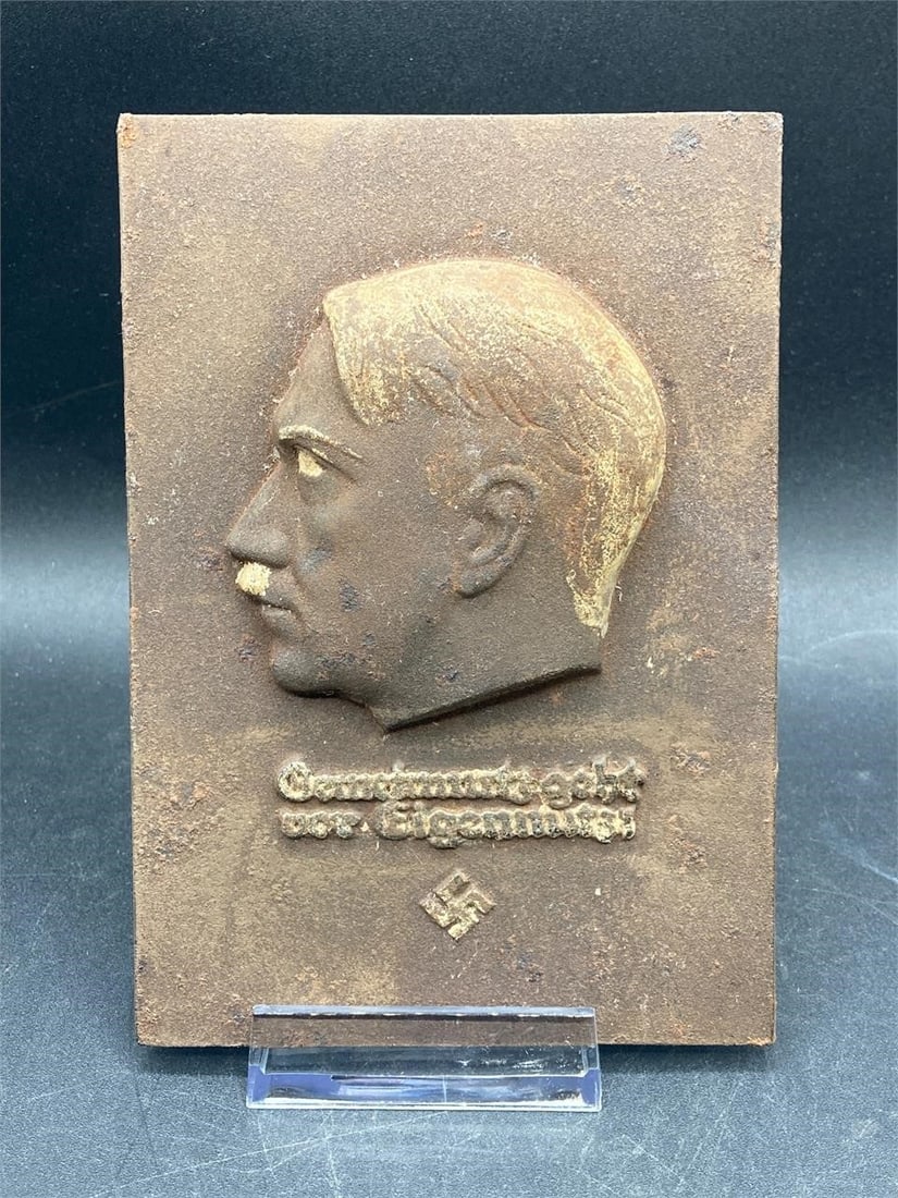 4x6" NSDAP Adolf Hitler Iron Wall Plaque: Germans NSDAP Adolf Hitler iron wall plaque. Features relief bust of Hitler and "common interest before self interest" quote with NSDAP symbol. Plaque measures 4" wide and 6" tall. Plaque has surface 