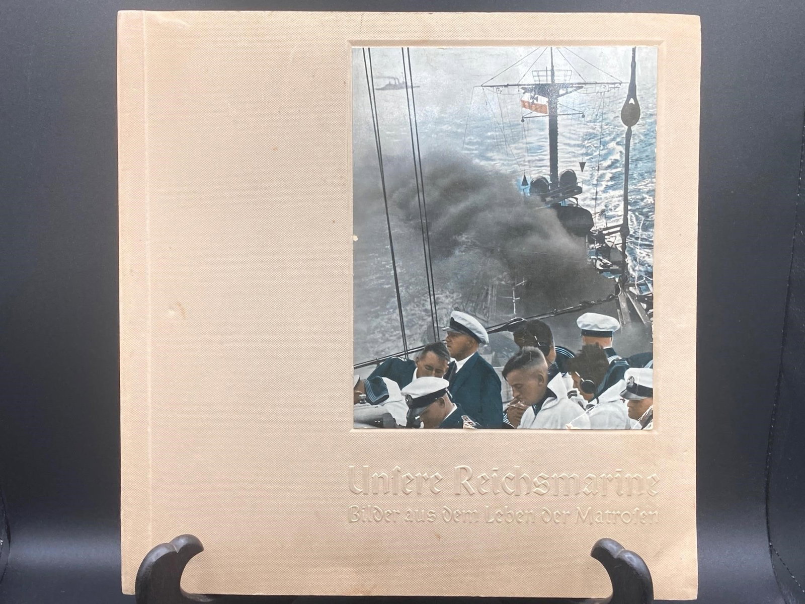 Unfere Reichsmarine WWII German Navy Scrapbook: Unfere Reichsmarine world war II German naval scrapbook. Features many photos of German naval operations with notes. 56 pages. Book is in good condition.Measurements: 12" W, 12" L, 1" H, 2 pounds
