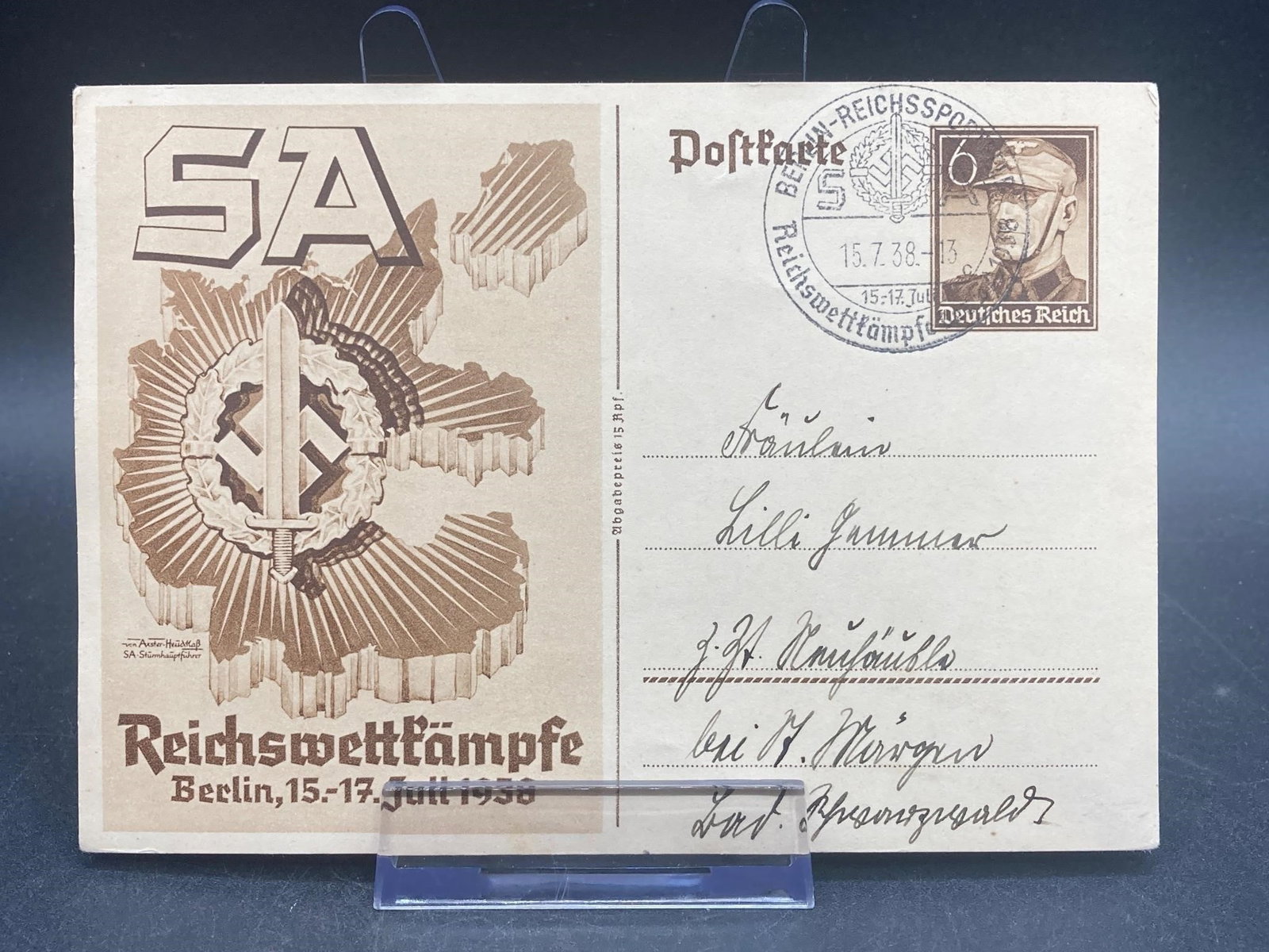 WWII German Reichswettkampf Postcard: World war II era German postcard. Stamped and dated 1938 with hand written notes in front and back. Postcard is in excellent condition.Measurements: 4" W, 6" L, 1" H, 1 pound