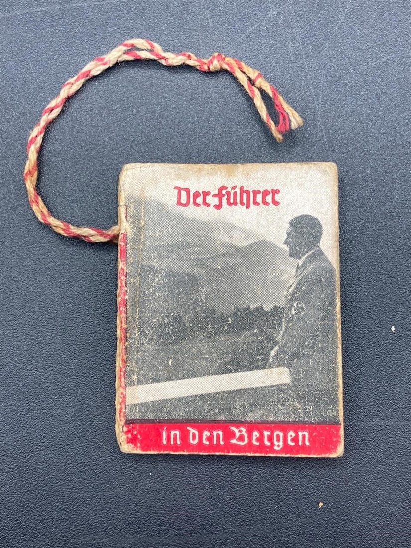 1930s German NSDAP Miniature Photo Book: 1930s German NSDAP miniature propaganda photo book, "Der Fuhrer in den bergen". Small 2" size book features black & white photos and propaganda for the NSDAP. Some light wear to front and back covers,