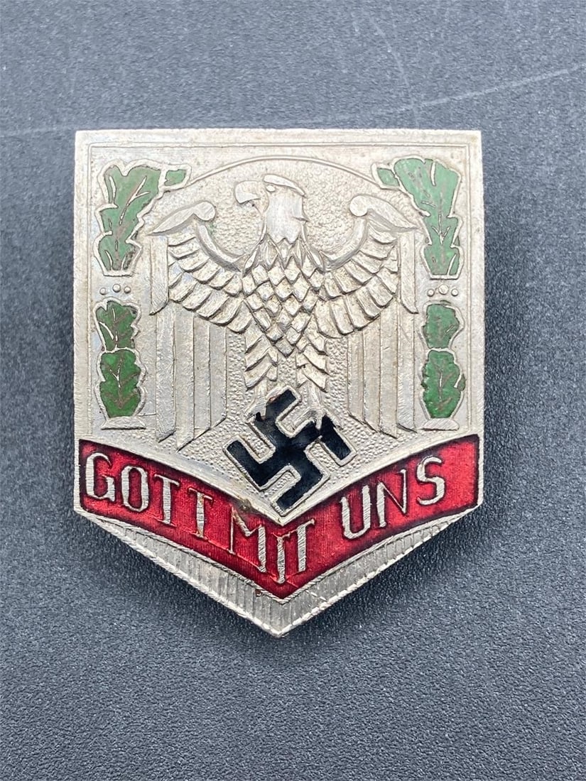 WWII German NSDAP Gott Mit Uns Badge: World war II German NSDAP "Gott mit uns" shield badge. Enameled details on front. Screw back style, GES GESCH stamp noted in photos. Measures 1 3/4" long. Some light wear, overall item is in very good