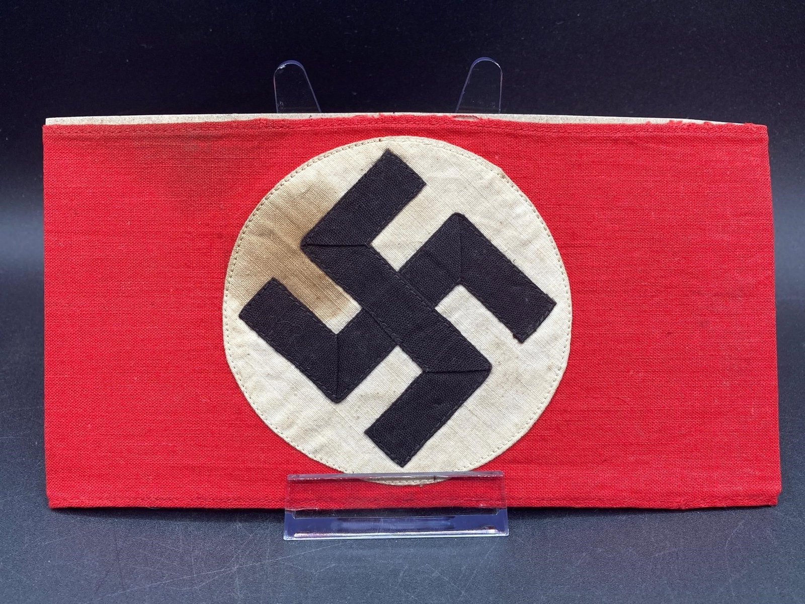 Original WWII German NSDAP Armband: Original German world war II NSDAP armband. Cotton material with prominent NSDAP symbol stitched on center. Maker stamp on back noted in photos. Measures 7 3/4" long. Some visible stains on front, oth