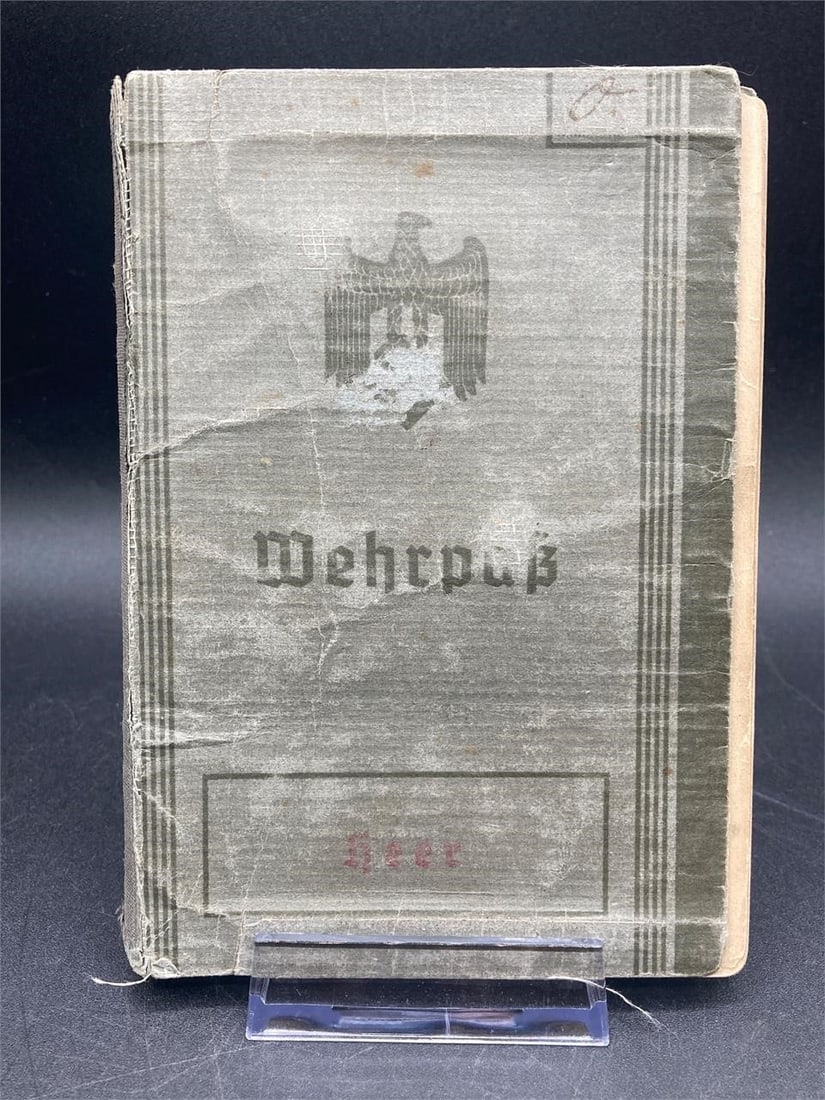 Original WWII German Army Officer Wehrpass: Original world war 2 German army officer's wehrpass (war papers). Contains photo, vital statistics, battle logs, stamps and death information. Cover is worn and separated from pages so will require ca