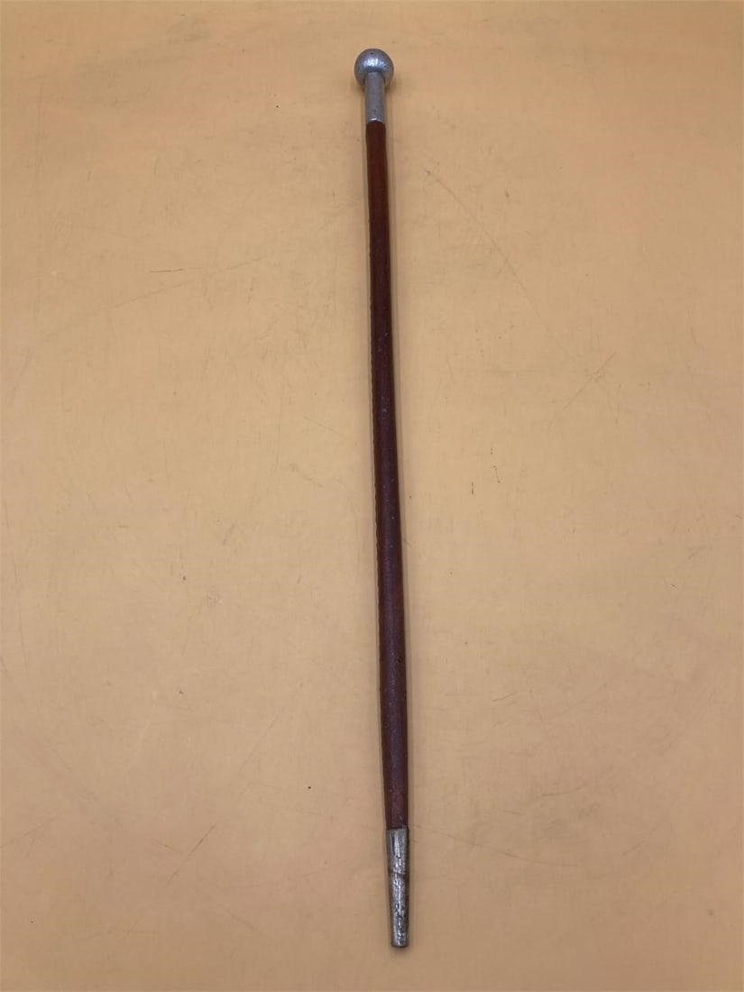 Antique Military Swagger Stick: Antique military swagger stick. Typically used by officers and on horseback. Leather wrapped metal with round ball head. Unmarked, likely world war 1 or world war 2 era. Measures 22 3/4" long. Some li
