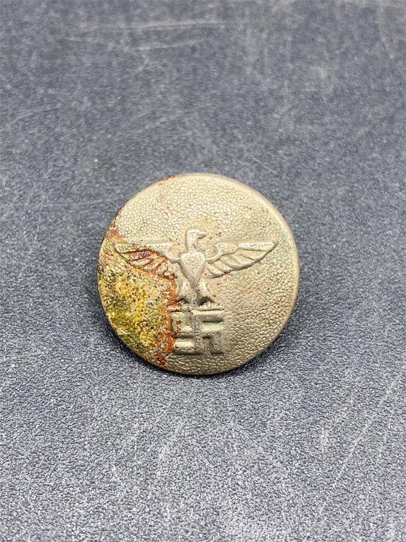 WWII German Military Uniform Button: World War II era German NSDAP uniform button. 20mm size button with eagle and NSDAP symbol. Back of button has visible surface rust, front has visible stain otherwise item is good condition.Measuremen