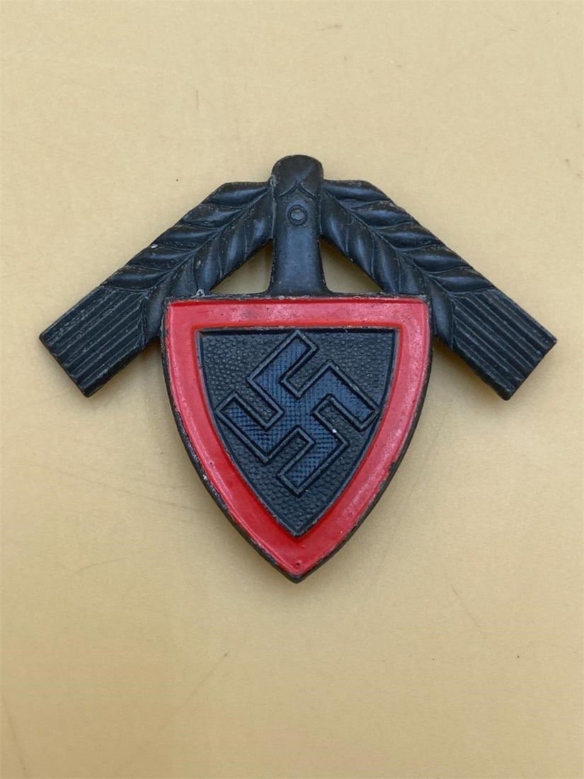 WWII German RAD Cap Badge: World War II German RAD member cap badge. Makers stamps on back noted in photos. Measures 1 1/2". Pin is in excellent condition.Measurements: 2" W, 2" L, 1" H, 1 pound