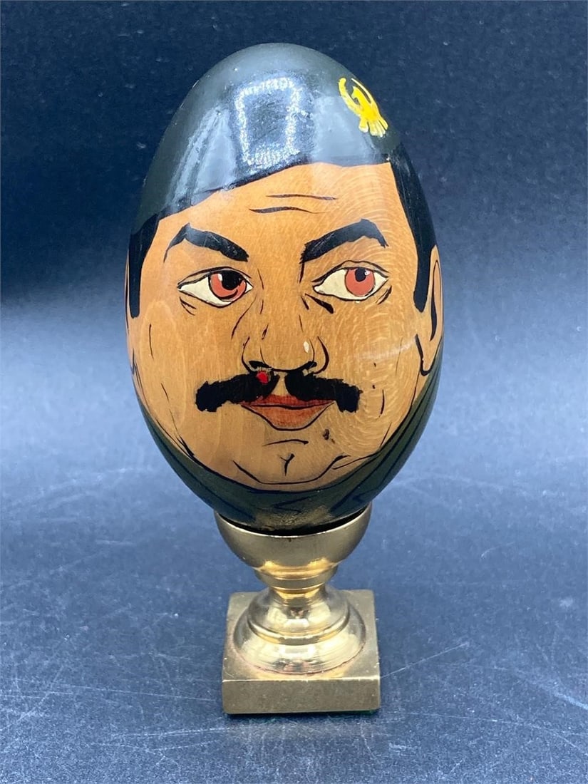 Hand Painted Fidel Castro Wooden Egg: Hand painted wooden Fidel Castro wooden egg with brass stand. Detailed caricature of Castro in military uniform. Figure measures 3" tall. Item is in excellent condition.Measurements: 3" W, 3" L, 5" H,