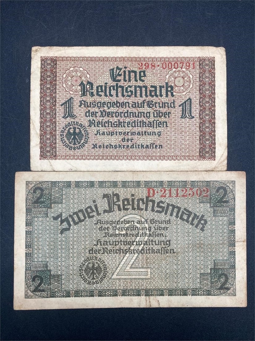 WWII Era German 1 & 2 Reichsmark Bank Notes: One 1940s German 1 reichsmark bank note and one 1940s German 2 reichsmark bank note. Ungraded, bills have some wear and light creasing.Measurements: 3" W, 6" L, 1" H, 1 pound