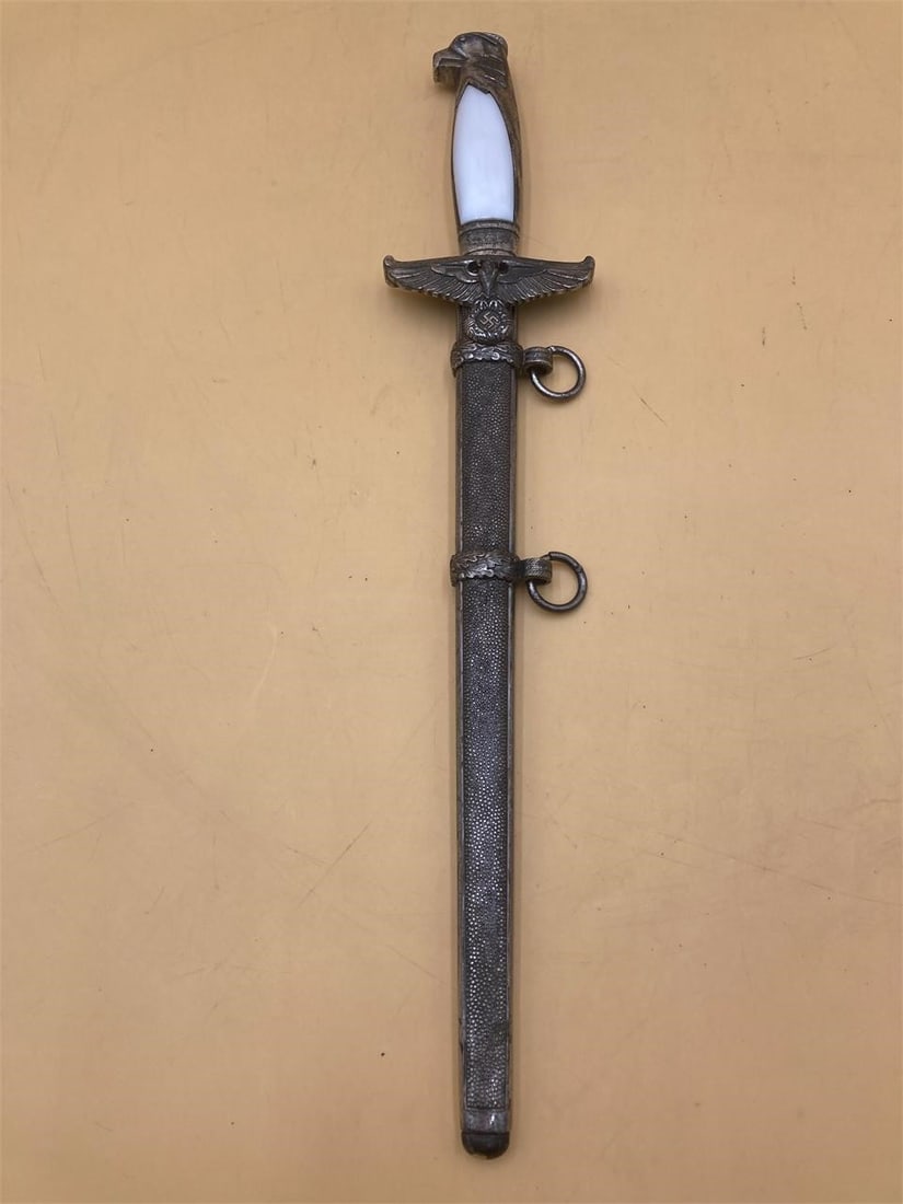 NSDAP German Government Official's Dagger Replica: NSDAP government official dagger by F.W. Holler. This is a 1970s reproduction of a world war 2 era diplomat's dagger. Maker stamp noted in photos. Features eagle head handle and NSDAP eagle hilt. Blad