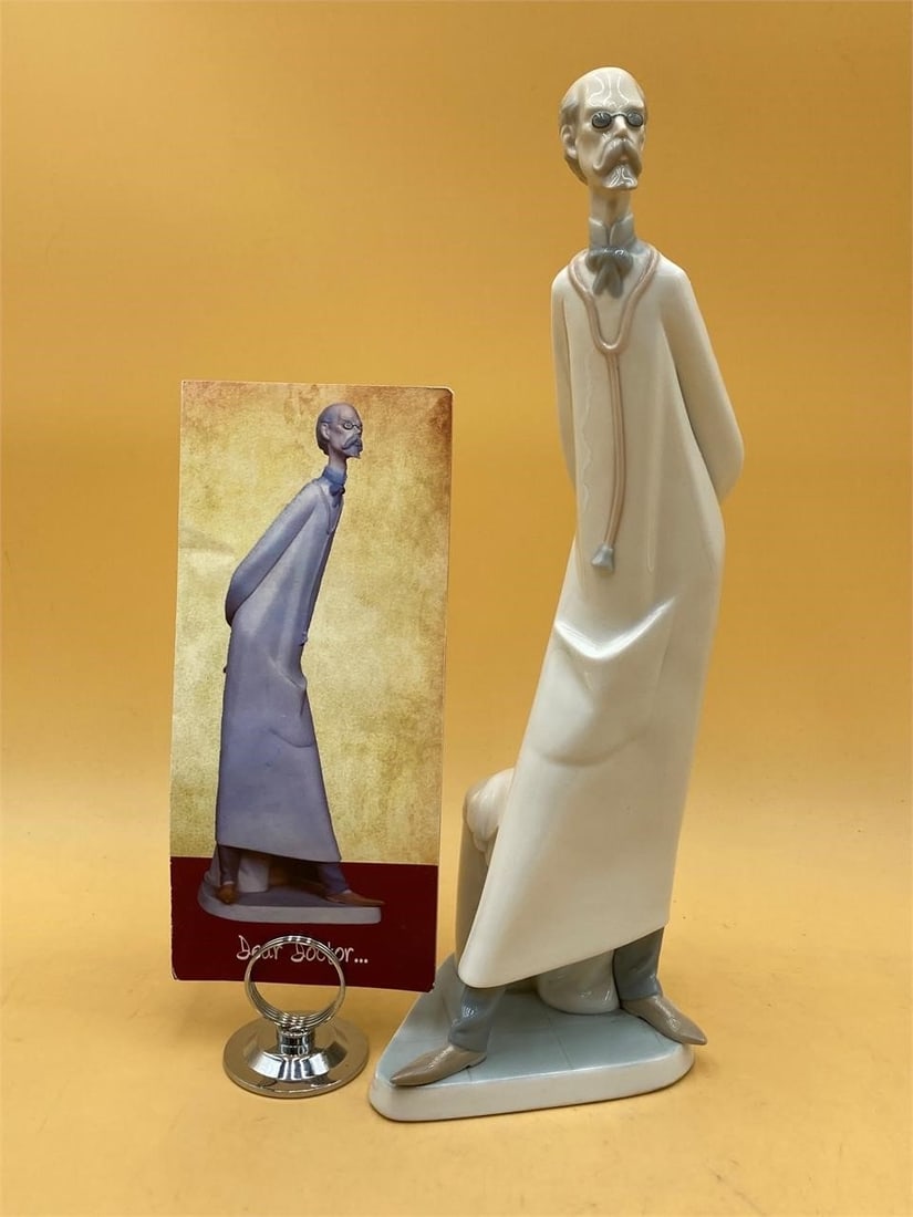 Llardo 15" Porcelain Doctor Figure: Llardo porcelain doctor statue with original pamphlet. Hand made glazed porcelain doctor figure with stethoscope and traditional white coat. Measures 15" tall. Statue is in excellent condition.Measure