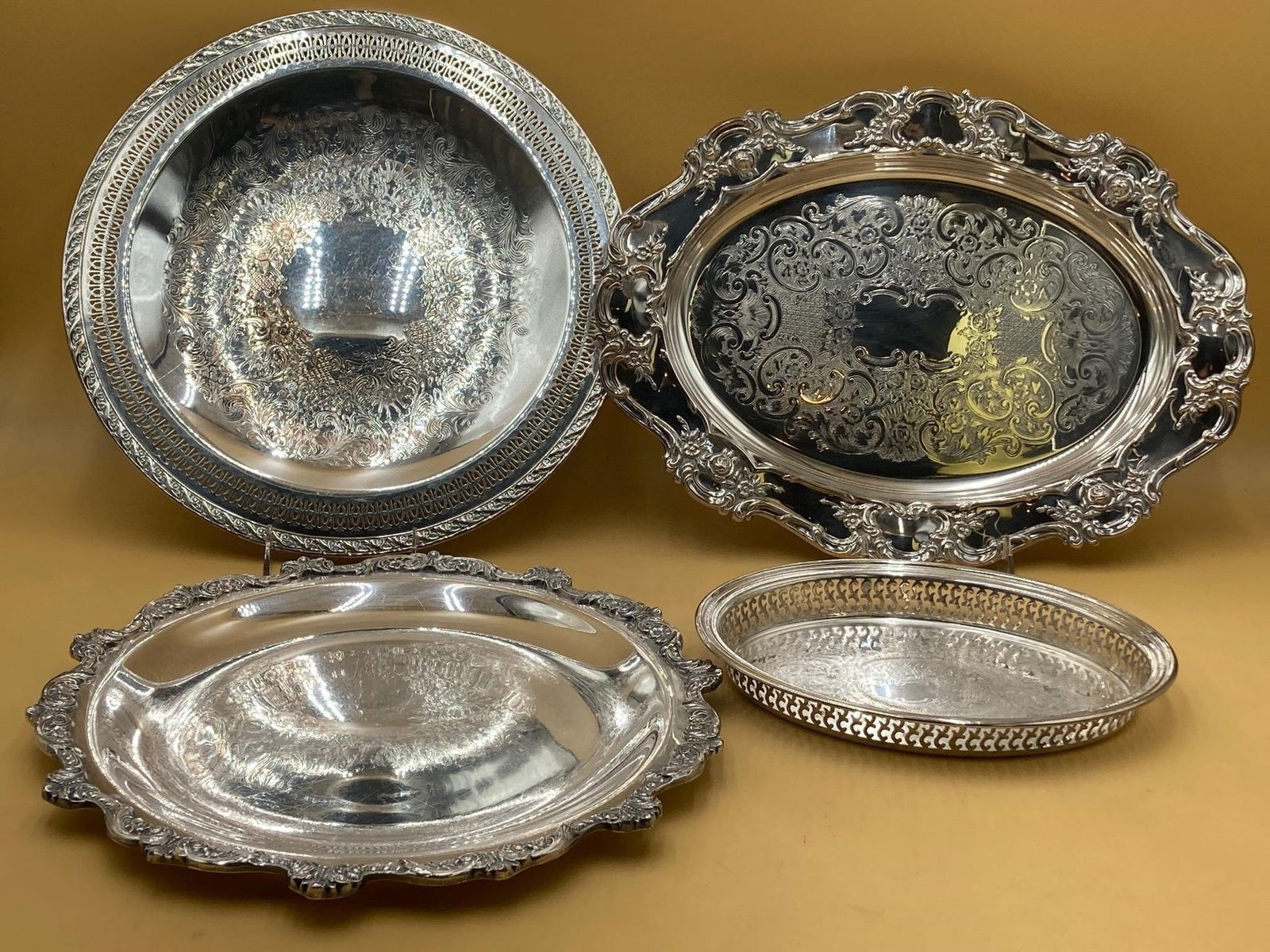 Set of large three silver plated serving trays. Trays feature ornate and flower designs on rims and (1 of 11)