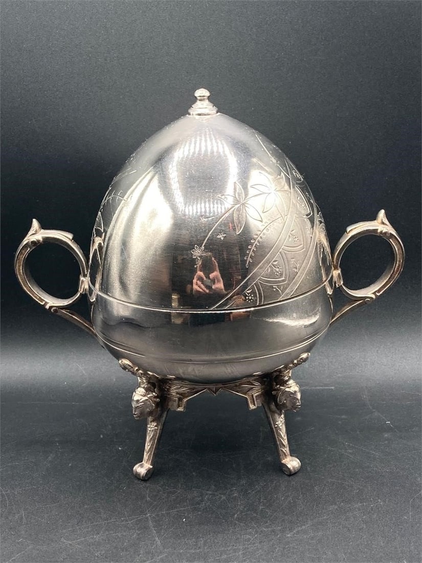 Antique New Haven quadruple silver plated sugar bowl. Features ornate and flower designs on handles: Antique New Haven quadruple silver plated sugar bowl. Features ornate and flower designs on handles and body and lion head accented legs. Maker mark and 1892 date notes in photos. Measures 8" tall. It