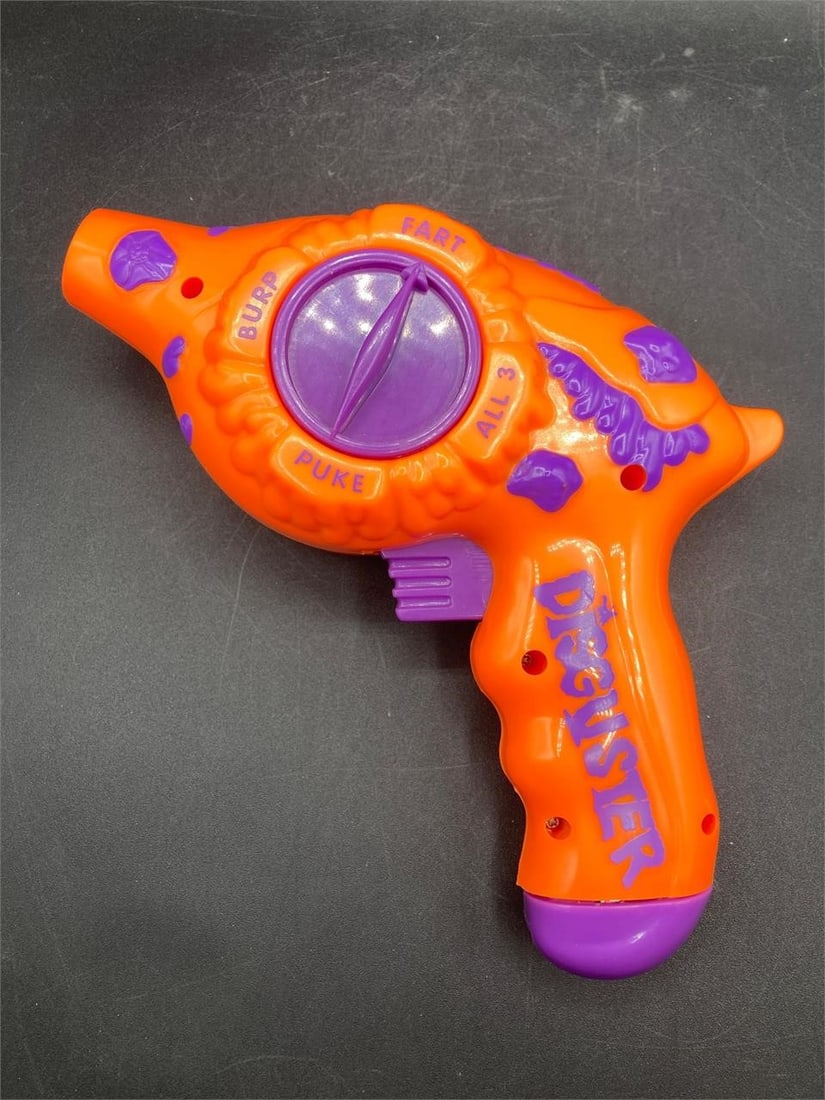 Disguster Novelty Sound Toy: Disguster novelty sound toy. Battery operate gun shaped toy has fart, burp and puke sound effects when trigger is pulled. Tested in working condition.Measurements: 8" W, 8" L, 3" H, 1 pound