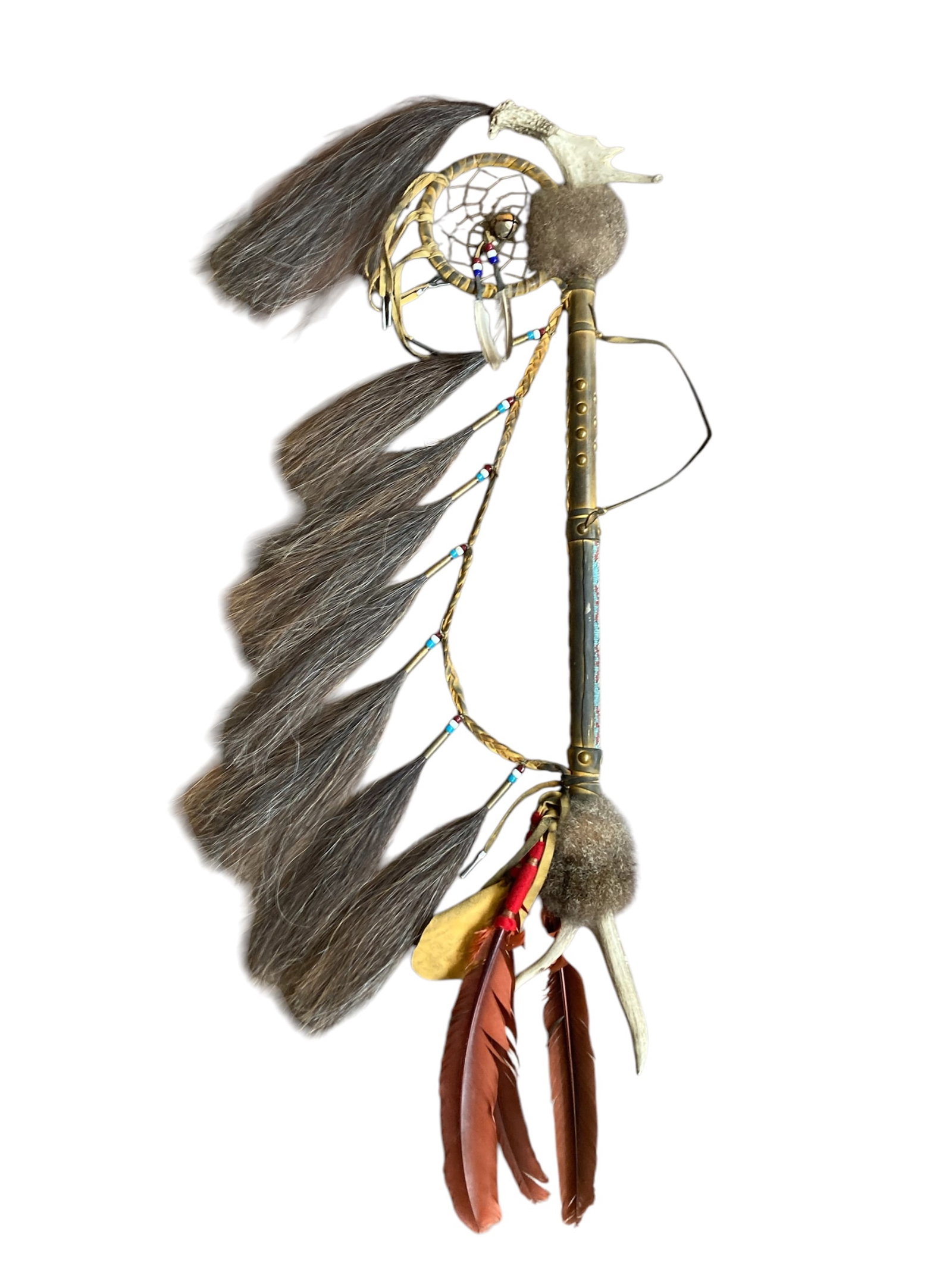 Handcrafted Native American Ceremonial Staff?: This is a handcrafted ceremonial staff primarily made of wood and leather with intricate decorative elements. It incorporates braided leather, beadwork, a dreamcatcher design, animal hair, feathers, a