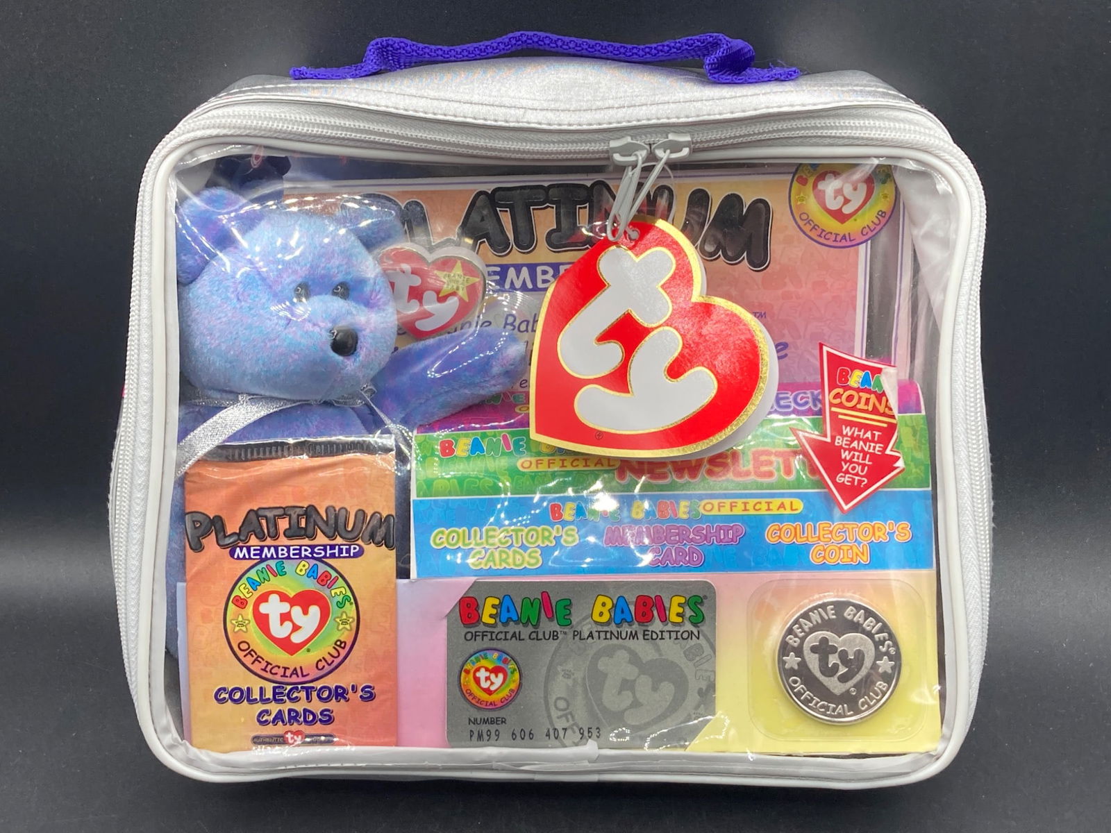 Beanie Babies Club Platinum Member Gift Set: This listing includes the Beanie Babies club platinum member gift set, featuring a variety of exclusive collector's items. Contents of the set include: | | - One Beanie Baby stuffed bear (visible in p