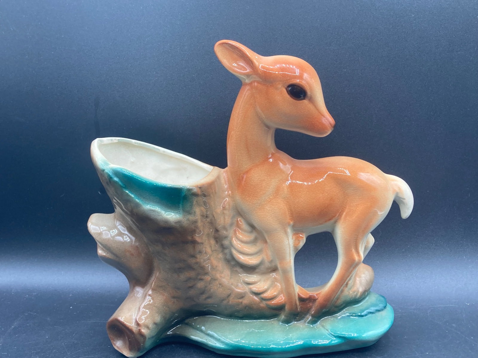 Royal Copley MCM Porcelain Deer Planter: This is a Royal Copley porcelain deer planter featuring the iconic mid-century aesthetic. Produced between 1948 and 1957, this piece showcases subtle airbrushed color transitions and a serene depictio