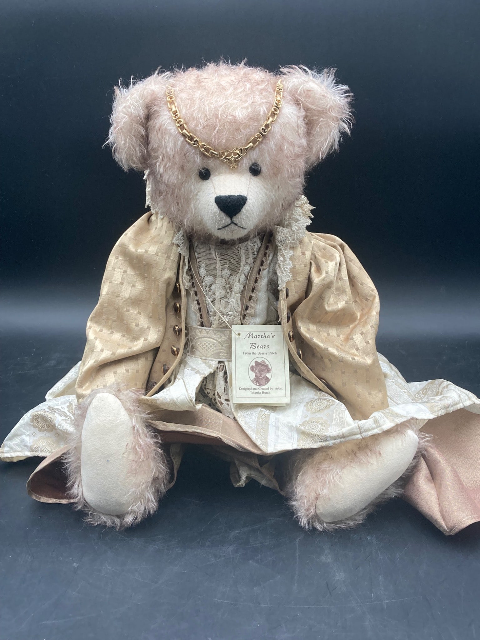 Victoria Mohair Teddy Bear by Martha™s Bears: A handcrafted mohair teddy bear named Victoria, created by Martha Burch of Martha™s Bears. This collectible bear features detailed clothing, including a gold-toned gown with lace accents and a gold 